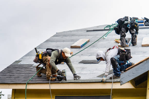 Professional Roofing technician working in Southold, NY